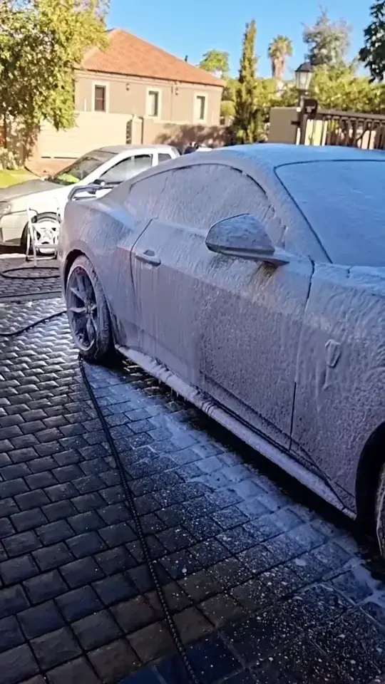 Coupe being hand washed after snow foam